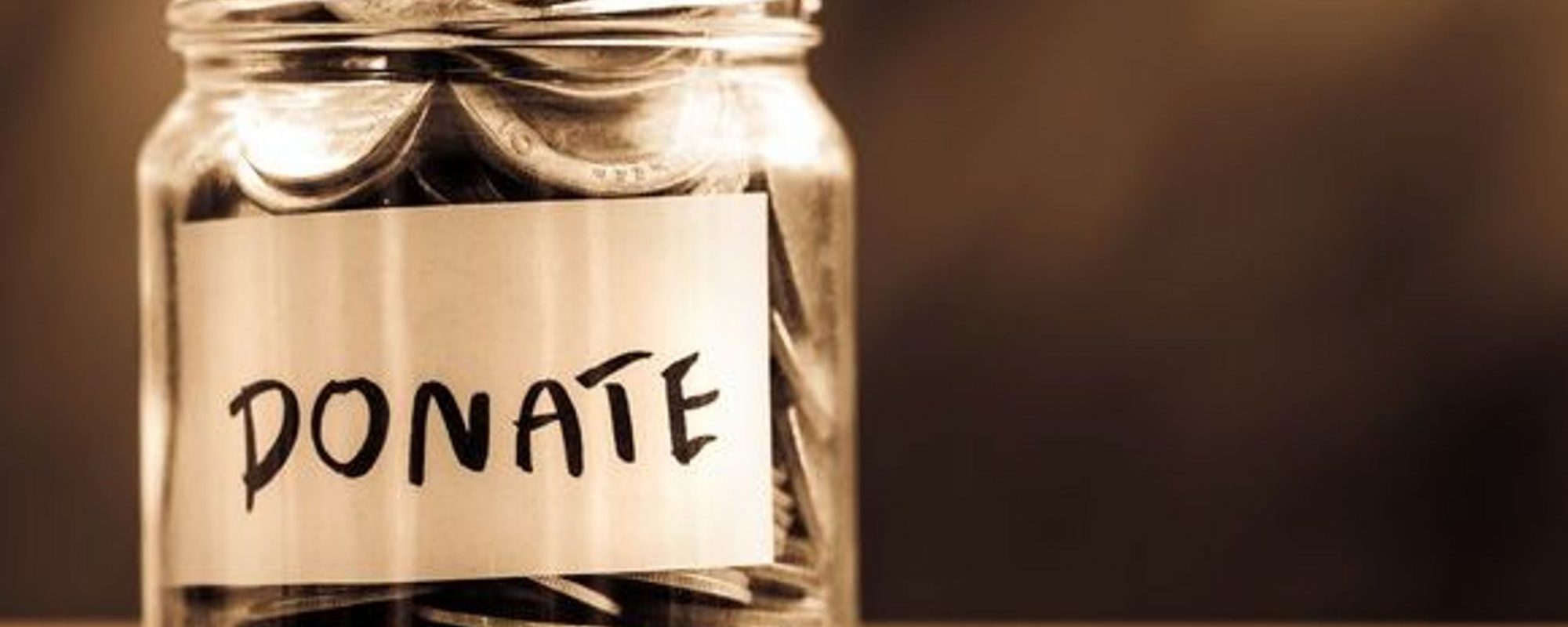 glass-jar-full-of-cois-with-donate-written-on-it-charity-donation-philanthropy_large-2000x1050